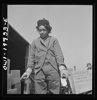 Kansas City, Missouri. Mildred Williams, one of several women freight handlers employed at the Atchison, Topeka, and Santa Fe freight depot. Sourced from the Library of Congress.