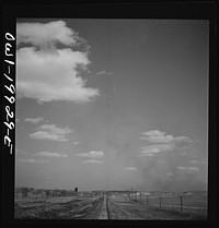 [Untitled photo, possibly related to: Miami, Texas. Train stopping for water along the Atchison, Topeka, and Santa Fe Railroad between Canadian and Amarillo, Texas]. Sourced from the Library of Congress.