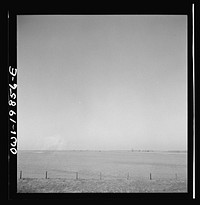 [Untitled photo, possibly related to: Argonis, Kansas. Crossing wheat fields along the Atchison, Topeka and Santa Fe Railroad between Wellington, Kansas and Waynoka, Oklahoma]. Sourced from the Library of Congress.