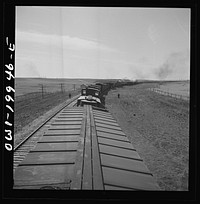 Hoover, Texas. An Atchison, Topeka, and Santa Fe train stopping to let an east-bound freight go by between Canadian and Amarillo, Texas. Sourced from the Library of Congress.