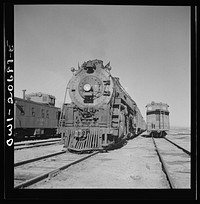 [Untitled photo, possibly related to: Vaughn, New Mexico. Easternbound train about to leave the Atchison, Topeka and Santa Fe Railroad yard on the return trip]. Sourced from the Library of Congress.