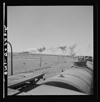 [Untitled photo, possibly related to: Fort Sumner, New Mexico. Train about to cross Pecos River along the Atchison, Topeka, and Santa Fe Railroad between Clovis and Vaughn, New Mexico]. Sourced from the Library of Congress.