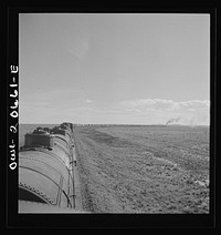 [Untitled photo, possibly related to: Buchanan, New Mexico. Rounding a long curve approaching the town along the Atchison, Topeka, and Santa Fe Railroad between Clovis and Vaughn, New Mexico]. Sourced from the Library of Congress.