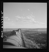 Duoro, New Mexico. Rounding a curve in the sheep and cattle country along the Atchison, Topeka, and Santa Fe Railroad between Clovis and Vaughn, New Mexico. Sourced from the Library of Congress.