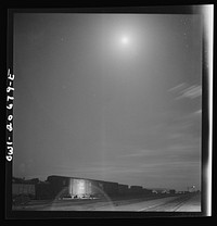 Vaughn, New Mexico. Train inspector at work in the Atchison, Topeka and Santa Fe Railroad yard, between Clovis and Vaughn, New Mexico. Sourced from the Library of Congress.