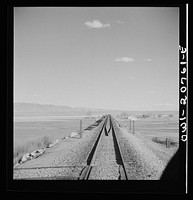 Belen, New Mexico. Going across the Rio Grande River Valley on the Atchison, Topeka and Santa Fe Railroad between Vaughn and Belen, New Mexico. There is a drop of over 1600 feet in elevation. Sourced from the Library of Congress.