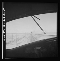 [Untitled photo, possibly related to: The diesel freight train along the Atchison, Topeka and Santa Fe Railroad between Winslow and Seligman, Arizona stops for a red signal, since there is another train in the block ahead]. Sourced from the Library of Congress.