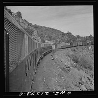 [Untitled photo, possibly related to: Williams, Arizona. A diesel freight train climbing through mountainous area along the Atchison, Topeka, and Santa Fe Railroad between Winslow and Seligman, Arizona]. Sourced from the Library of Congress.