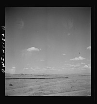 [Untitled photo, possibly related to: South Chaves (vicinity), New Mexico. On the Atchison, Topeka and Santa Fe Railroad between Belen and Gallup, New Mexico, passing an eastbound passenger train]. Sourced from the Library of Congress.