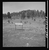 Williams (vicinity), Arizona. A sign marking the Arizona divide along the Atchison, Topeka and Santa Fe Railroad between Winslow and Seligman, Arizona. Sourced from the Library of Congress.