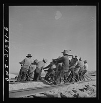 Needles, California. An Indian section gang at work on the tracks in the Atchison, Topeka and Santa Fe Railroad yards. Sourced from the Library of Congress.