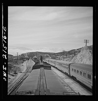 [Untitled photo, possibly related to: Summit (vicinity), California. Passing an eastbound passenger train, the Chief, while coming down the mountain on the Atchison, Topeka, and Santa Fe Railroad between Barstow and San Bernardino, California]. Sourced from the Library of Congress.