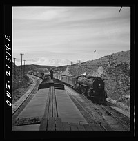 Summit (vicinity), California. Passing an eastbound passenger train, the Chief, while coming down the mountain on the Atchison, Topeka, and Santa Fe Railroad between Barstow and San Bernardino, California. Sourced from the Library of Congress.