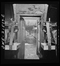 San Bernardino, California. A tunnel at the ice plant through which air is blown on its way to the refrigerator cars. Cooling tubes along the walls keep the air at a constant temperature. Sourced from the Library of Congress.