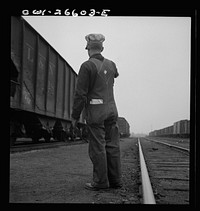 [Untitled photo, possibly related to: Switching a train with a diesel switch engine on the Chicago and Rock Island Railroad]. Sourced from the Library of Congress.
