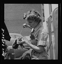 [Untitled photo, possibly related to: Philadelphia, Pennsylvania. Miss Natalie O'Donald, a garage attendant at the Atlantic Refining Company garages]. Sourced from the Library of Congress.