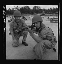 [Untitled photo, possibly related to: Warner Robins, Georgia. Air Service Command, Robins Field. Learning to handle a carbine]. Sourced from the Library of Congress.