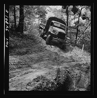 Warner Robins, Georgia. Air Service Command, Robins Field. Part of the training of the truck drivers of the depot group consists of driving many times through an obstacle course in the woods. Sourced from the Library of Congress.