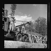 [Untitled photo, possibly related to: Warner Robins, Georgia. Air Service Command, Robins Field. Practicing picking up and loading of an old P-39 with a C3 truck and trailer]. Sourced from the Library of Congress.