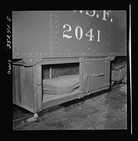 Clovis, New Mexico. Compartment in a new Atchison, Topeka and Santa Fe Railroad caboose containing a "frog" for rerailing a car. Sourced from the Library of Congress.