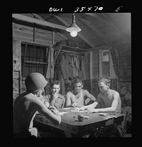 Greenville, South Carolina. Air Service Command. Men of the Quartermaster Truck Company of the 25th service group having a card game in one of the barracks. Sourced from the Library of Congress.