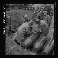 Greenville, South Carolina. Air Service Command. Men of the ordnance, supply and maintenance company of the 25th service group taking 2000 pound bombs out of the revetment area. Sourced from the Library of Congress.