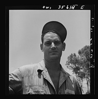 [Untitled photo, possibly related to: Myrtle Beach, South Carolina. Air Service Command. Staff Sergeant L. W. Henderson, airplane mechanic with a mobile unit. His home was in Colorado City, Texas, where he worked as a pipeliner and oil field worker]. Sourced from the Library of Congress.