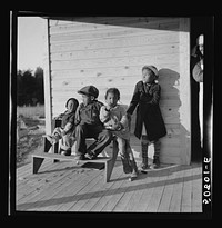 Children of rehabilitation client on front porch of new home near Raleigh, North Carolina. Sourced from the Library of Congress.