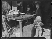 [Untitled photo, possibly related to: Children of migrant packinghouse workers, living in a "lean-to" made of pieces of rusty galvanized tin and burlap. They are left alone all day and often until three a.m. Both parents work when possible. Belle Glade, Florida]. Sourced from the Library of Congress.