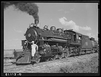 USSC (United States Sugar Corporation) hauls sugarcane from the fields to its mill by their own railroad system. Clewiston, Florida. Sourced from the Library of Congress.