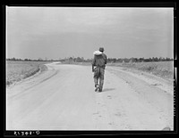 [Untitled photo, possibly related to: Colored tenant farmer carrying home a sack of flour which he calls "heaven dust." Greene County, Georgia]. Sourced from the Library of Congress.