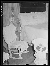 [Untitled photo, possibly related to: Jorena Pettway making flower decorations for her home. She has made practically all her own furniture and her own bedspreads and chair covers from flour sacks, etc. Gee's Bend, Alabama]. Sourced from the Library of Congress.
