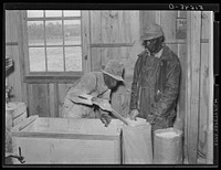 Project families have their corn ground into meal at cooperative grist mill. Gee's Bend, Alabama. Sourced from the Library of Congress.