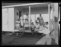 [Untitled photo, possibly related to: Home economics and home management class for adults, under supervision of Miss Evelyn M. Driver (standing in white uniform). Everything they make including the small handmade looms, utilizes materials of local origin as cornshucks, cane, flour and meal and feed sacks, etc. Flint River Farms, Georgia]. Sourced from the Library of Congress.