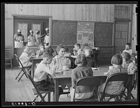 A hot mid-morning lunch in school. Ashwood Plantations, South Carolina. Sourced from the Library of Congress.