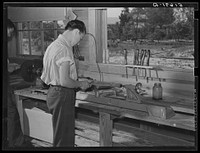 Clarence Haseldon turning lathe to make table leg in shop class. Ashwood Plantations school, South Carolina. Sourced from the Library of Congress.