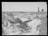 Soil erosion and remaining chimney of house. Greene County, Georgia. Sourced from the Library of Congress.
