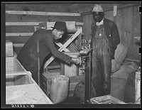 Inside the cooperative grist mill. Prairie Farms, Alabama. Sourced from the Library of Congress.