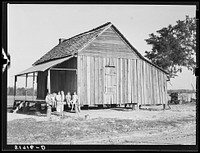 Mrs. Melody Tillery (RR-Rural Rehabilitation family) with her children on porch of their home. Pike County, Alabama. Sourced from the Library of Congress.