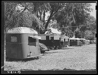 Tourist camp, showing many modern trailers crowded together, some of the families remaining for weeks and months. Dade City, Florida. Sourced from the Library of Congress.