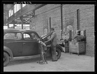 Testing motors of car in FSA (Farm Security Administration) warehouse depot. Atlanta, Georgia. Sourced from the Library of Congress.