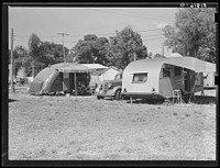 [Untitled photo, possibly related to: Tourist camp, showing many modern trailers crowded together, some of the families remaining for weeks and months. Dade City, Florida]. Sourced from the Library of Congress.