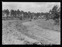 FSA (Farm Security Administration) supervisors watching terracing of client's land. Greene County, Georgia. Sourced from the Library of Congress.