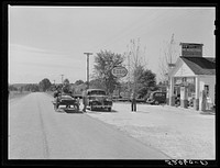 Combination filling station, garage, smith shop, grocery store. Frank Petty, owner of the wagon, has just had his mule shod, his corn ground, purchases some kerosene and is returning home.  R.F.D. Danville, Virginia, Pittsylvania County. Sourced from the Library of Congress.