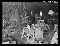 The smith and carpentry shop on Marcella Plantation, Mileston, Mississippi Delta. At the right is a piece of cotton hanging up which Uncle George the smith who has lived there fifty years keeps for good luck. Mississippi. Sourced from the Library of Congress.