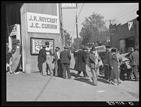 Outside tobacco warehouse during auction sales. Durham, North Carolina. Sourced from the Library of Congress.