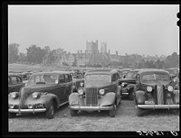 Cars parked in field near Duke University Stadium on day of Duke-Carolina football game. Durham, North Carolina. Sourced from the Library of Congress.