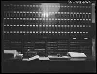 [Untitled photo, possibly related to: Files for documents and leather-bound books of records, deeds, etc. in the vault for records opening from clerk of court's office. Granville County Courthouse, Oxford, North Carolina]. Sourced from the Library of Congress.