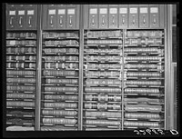 Files for documents and leather-bound books of records, deeds, etc. in the vault for records opening from clerk of court's office. Granville County Courthouse, Oxford, North Carolina. Sourced from the Library of Congress.