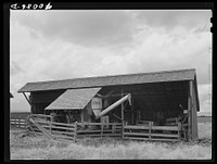 Storage of wheat combine. Idaho County, Idaho by Russell Lee